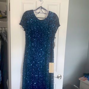 Elegant, floor length, sequined gown with scoop back, small train